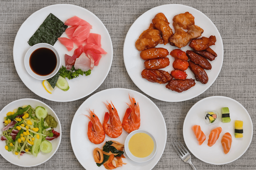 Premium buffet cuisine at Grill63 matches the spectacular elevation with culinary excellence